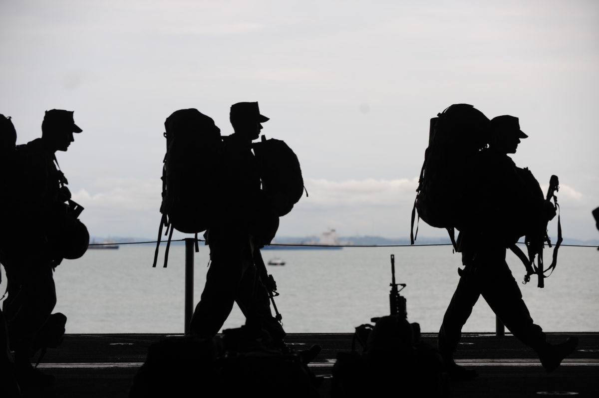 Canva Line of Soldiers Walkin State Veteran’s Benefits